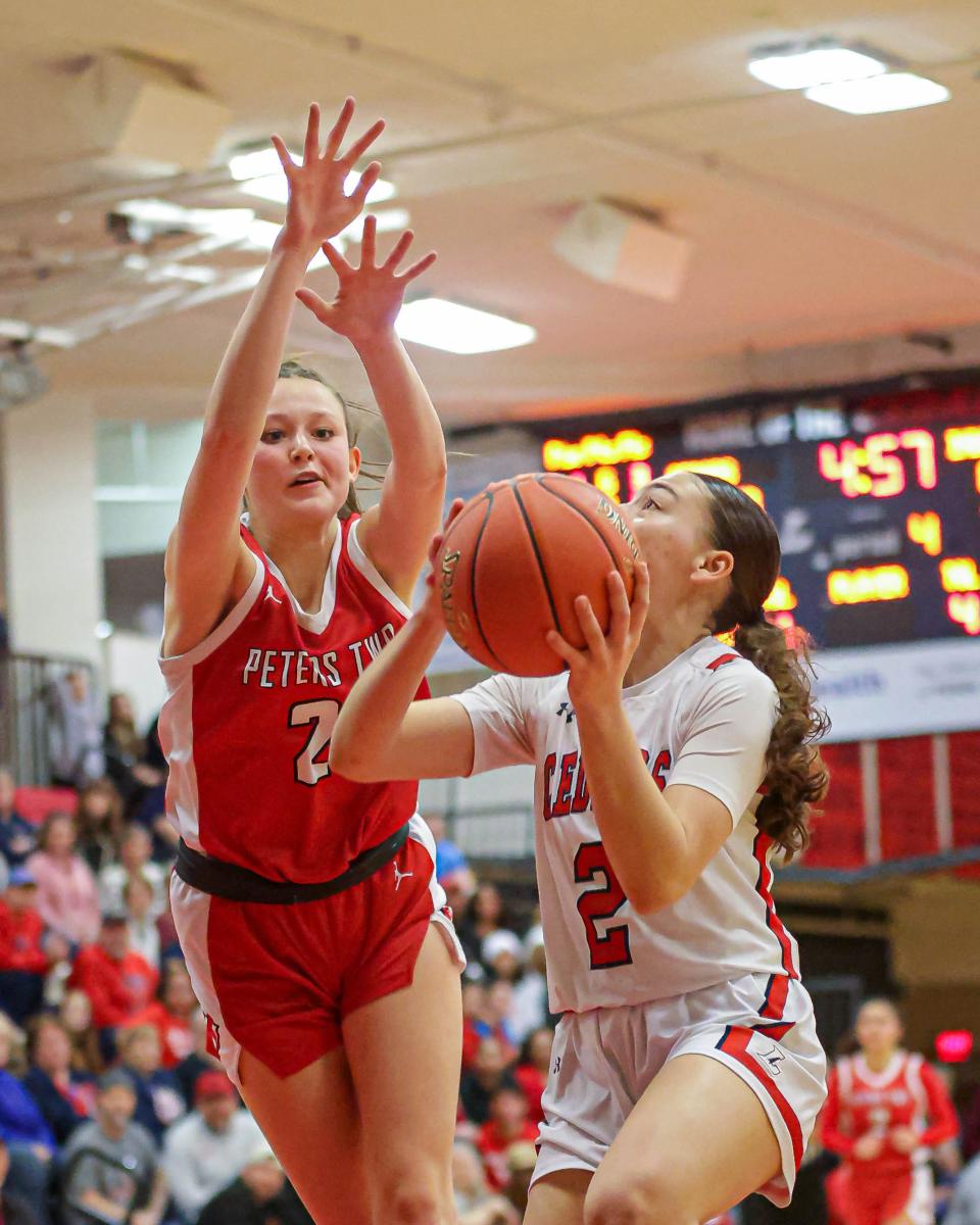 Lebanon's Olive Brandt (2) tries to avoid a Peters Township defender as she drives to the hoop in the first round of the PIAA Class 6A tournament on Friday, March 8, 2024. Peters Township won 69-49.