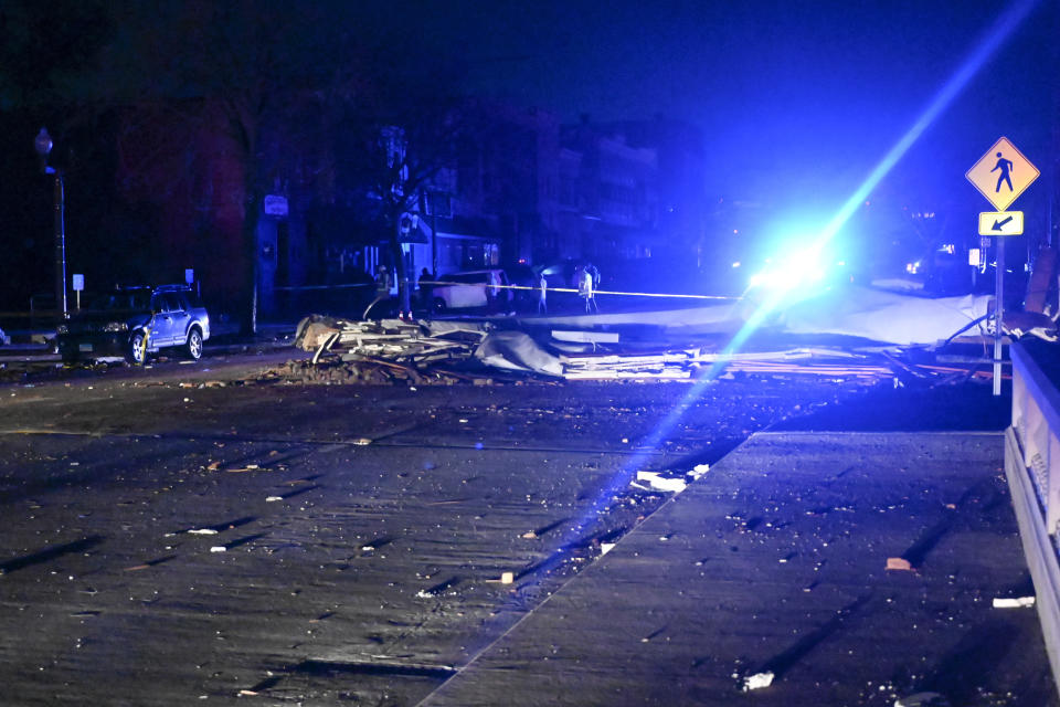 Rubble is seen near the Apollo Theatre, early Saturday, April 1, 2023, after a severe spring storm caused damage and injuries late Friday, in Belvidere, Ill. (AP Photo/Matt Marton)