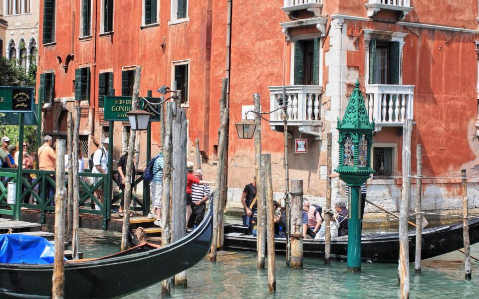 Transit via a large gondola instead of booking a private ride in Venice to save the pennies