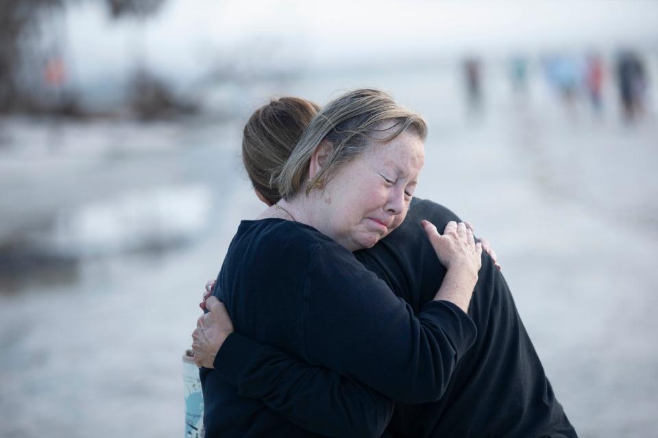 Lifelong friends, Janet Sheehan and Nancy Larkin embrace at the one year anniversary of Hurricane Ian at the Lighthouse Park on Sanibel on Thursday, Sept. 28, 2023