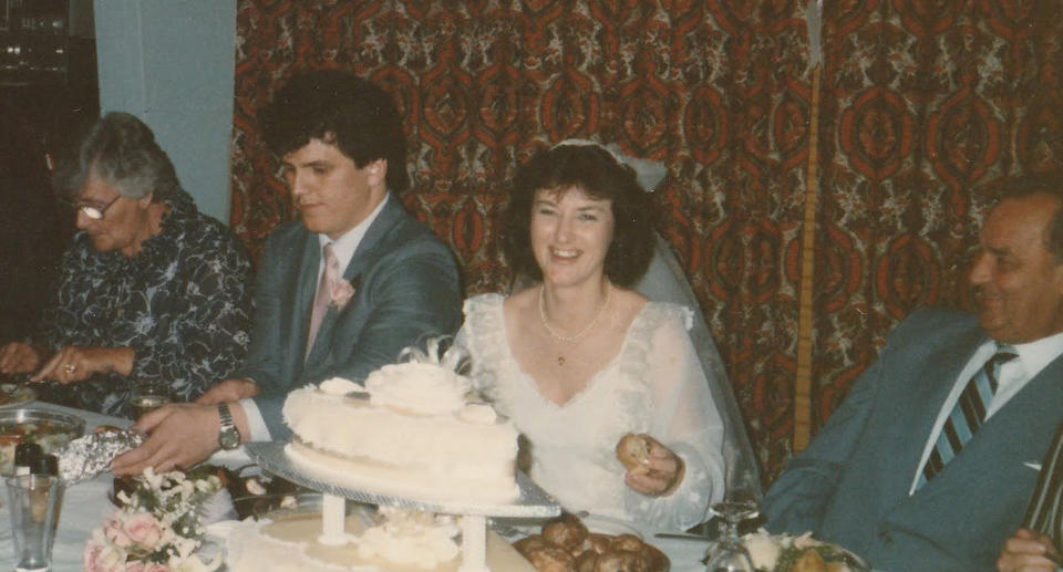 Michael and Joanna Vink sitting at the top table at their wedding reception in 1984.  