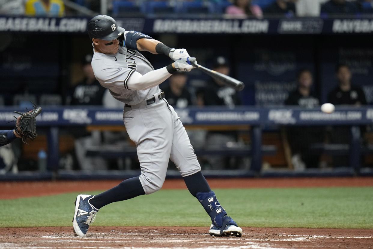 Aaron Judge gets a hit in Thursday night's game against the Rays.