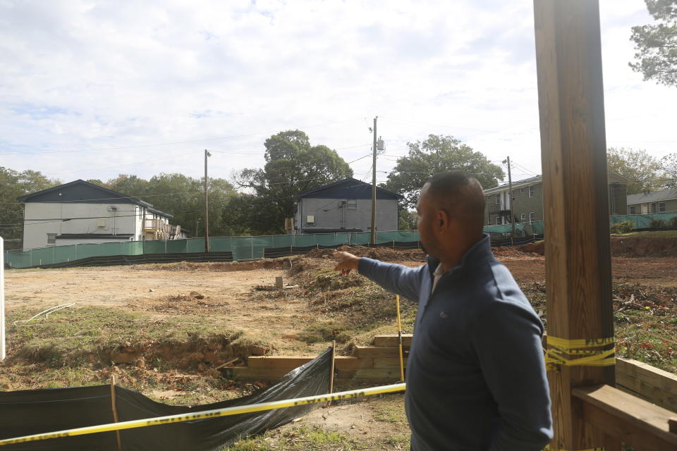 Veterans Empowerment Organization CEO Tony Kimbrough on Oct. 31, 2023, looks over the site on which a two-story building will soon be built to house 20 formerly homeless veterans in Atlanta. The Atlanta-based nonprofit houses dozens of veterans and helps put them on a path toward employment and housing independence. (AP Photo/R.J. Rico)