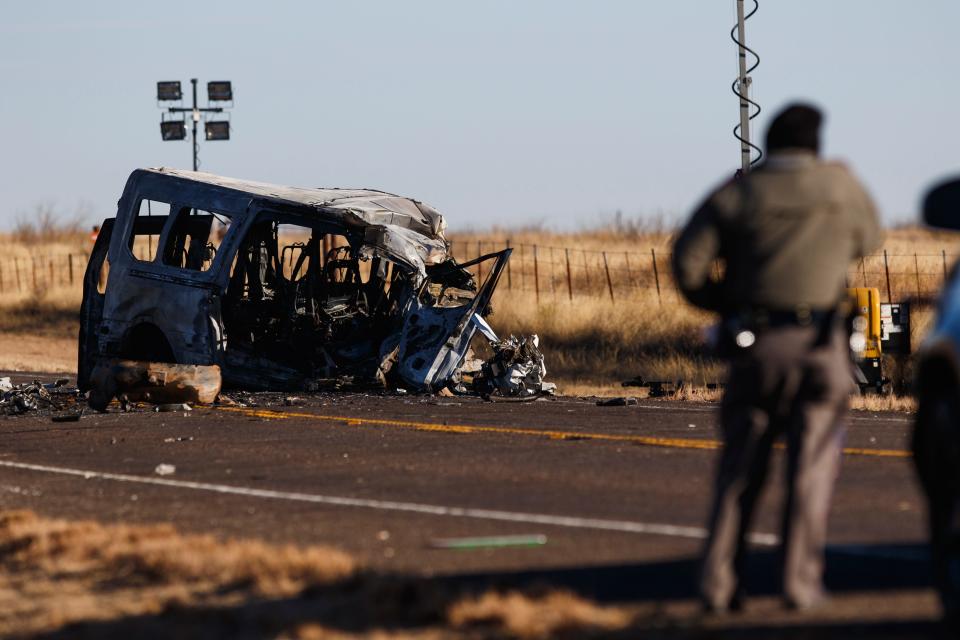 Texas Department of Public Safety troopers look over the scene of a fatal accident on State Highway 115 early Wednesday.