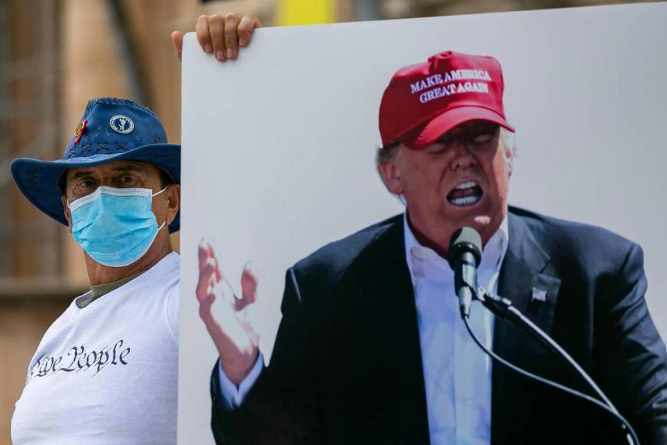 Supporters of President Donald Trump attend a protest at the Freedom Tower in downtown Miami on Saturday, Jan. 16, 2021.