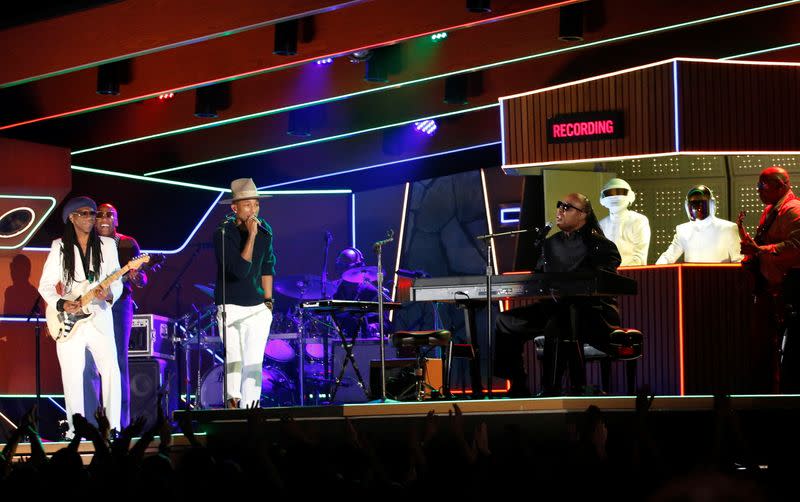 FILE PHOTO: Wonder performs the Daft Punk's song "Get Lucky" with Williams and Rodgers at the 56th annual Grammy Awards in Los Angeles