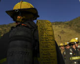 <p>Kurt Thomas, a West Metro Fire recruit, carries a fire hose with the names of the 343 fallen firefighters, that were during 9/11, during the, 10th annual, Colorado 9/11 Stair Climb at Red Rocks Amphitheatre on Sept. 11, 2018 in Morrison, Colorado. (Photo: R.J. Sangosti/The Denver Post via Getty Images) </p>