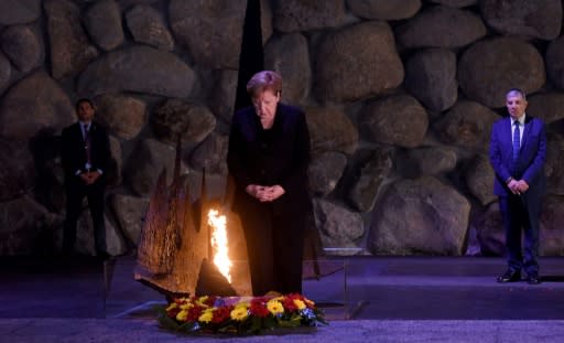 German Chancellor Angela Merkel pauses after laying a wreath in the Hall of Remembrance in the Yad Vashem Holocaust Museum in Jerusalem, on October 4, 2018