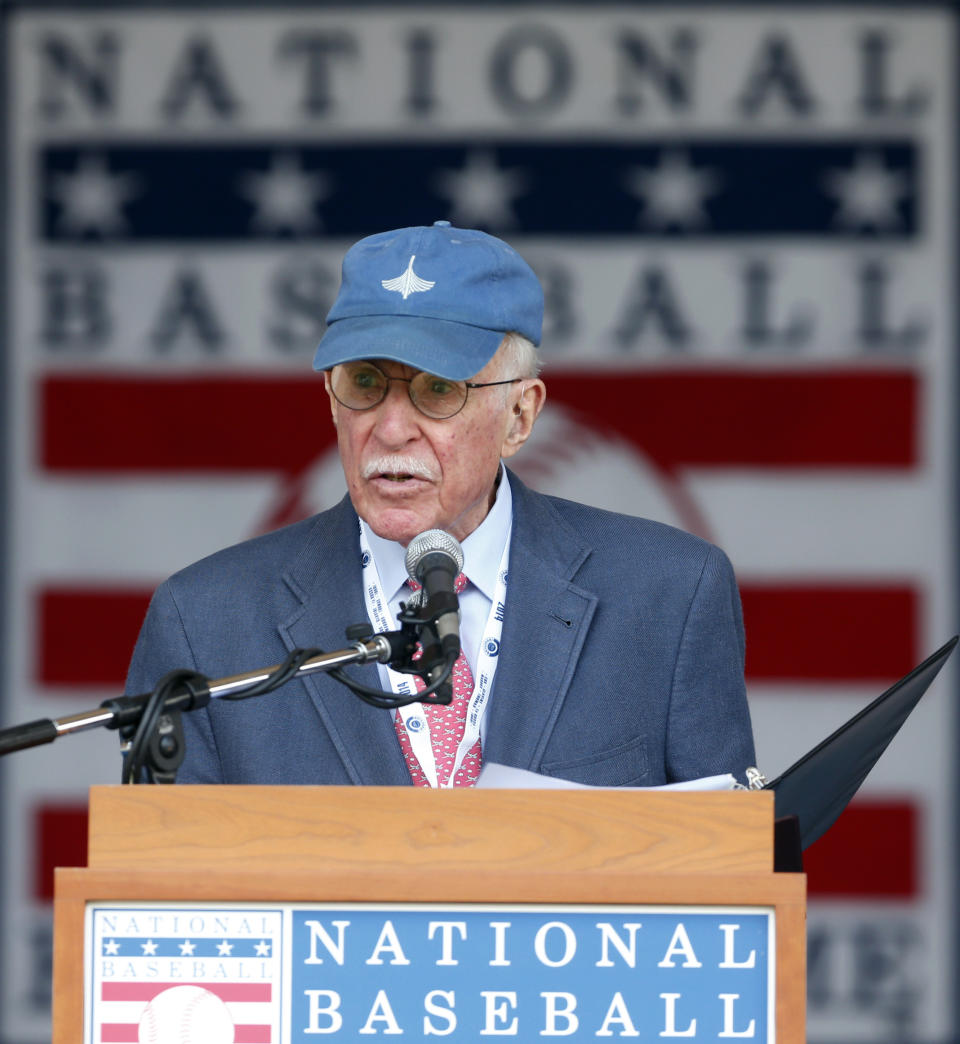 FILE - Roger Angell, of The New Yorker, speaks after receiving the J.G. Taylor Spink Award during a ceremony at Doubleday Field at the National Baseball Hall of Fame on July 26, 2014, in Cooperstown, N.Y. Angell, a longtime New Yorker writer and editor, has died the New Yorker announced Friday, May 20, 2022. He was 101. Angell, the son of founding New Yorker editor Katharine White and stepson of E.B. White, contributed hundreds of essays and stories to the magazine over a 70-year career. (AP Photo/Mike Groll, File)