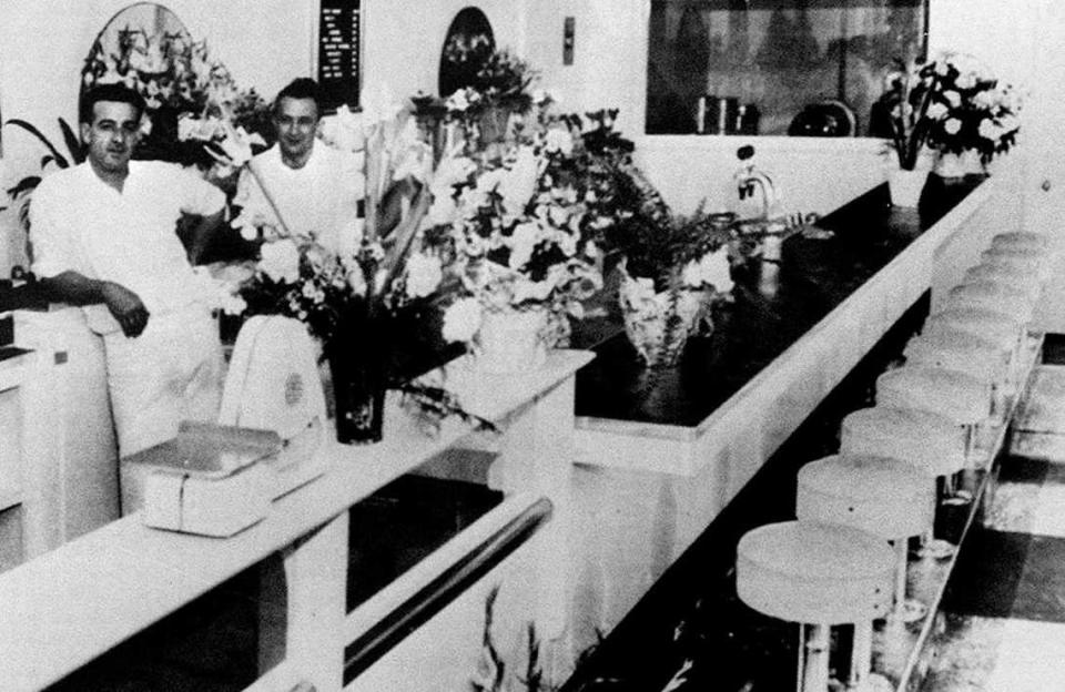 Vic Zito, left, and Ashley Rutledge are memorialized in an opening day photograph mounted on the wall next to the counter at the ice cream shop. Zito died in 1966. Craig Rutledge, Ash’s son who operated the ice cream parlor for 40 years, died Monday at the age of 73. Vic's Ice Cream