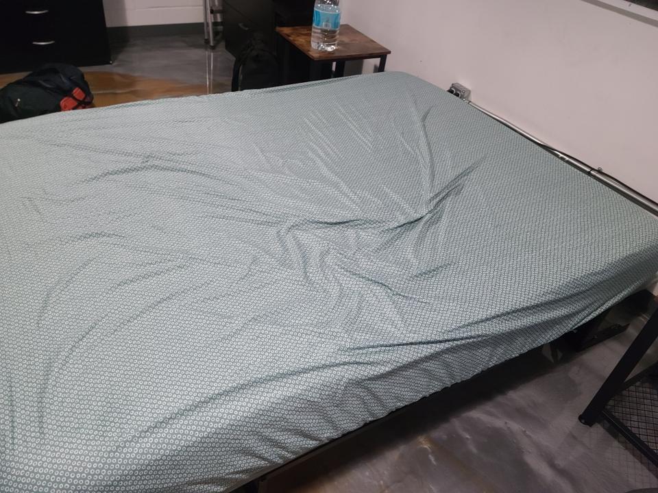 Bed with a sheet and no headboard