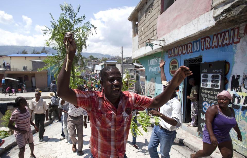 A protester chants anti-government slogans during a march against President Michel Martelly's government in Port-au-Prince, Haiti, Tuesday April 15, 2014. Those demonstrating called for the resignation of President Martelly. ( AP Photo/Dieu Nalio Chery)