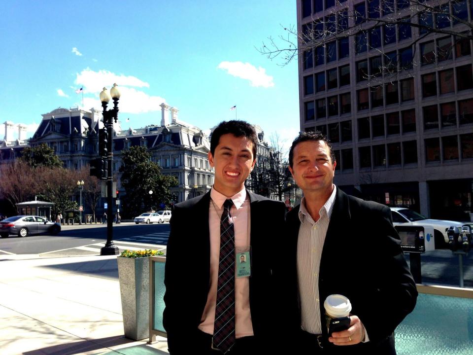 Julian Sarafian with his dad on the street right outside the White House grounds.