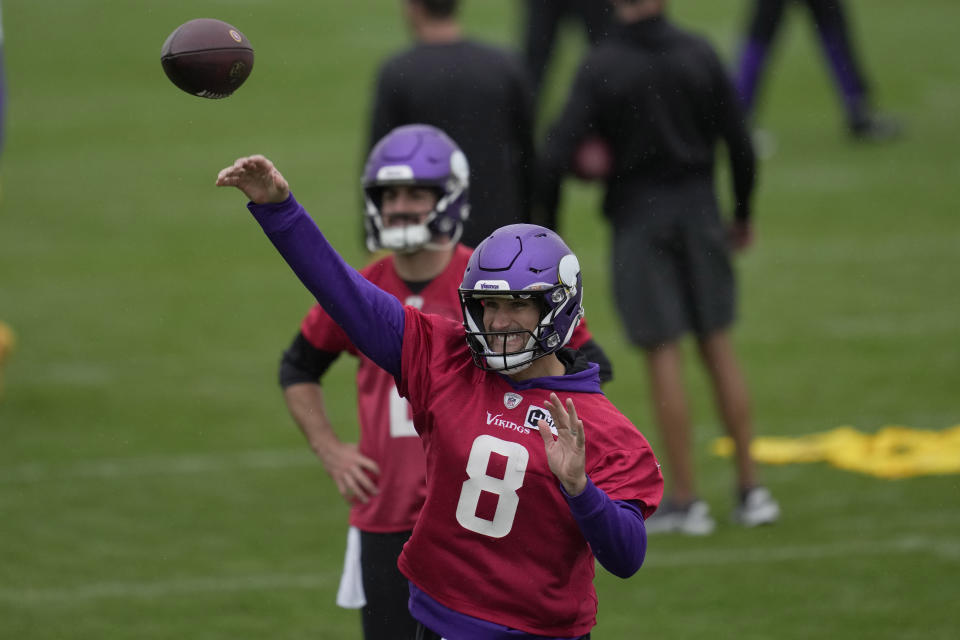 Minnesota Vikings quarterback Kirk Cousins passes the ball during a practice session in Thundridge, England, Friday, Sept. 30, 2022 ahead the NFL game against New Orleans Saints at the Tottenham Hotspur stadium on Sunday. (AP Photo/Kin Cheung)