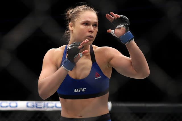 <p>Christian Petersen/Getty</p> Ronda Rousey and Amanda Nunes of Brazil face off in their UFC women's bantamweight championship