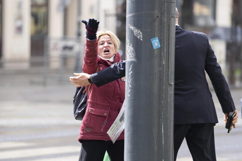 Protestors of an Iranian opposition group are sent away near the Grand Hotel Wien where closed-door nuclear talks with Iran take place in Vienna, Austria, Tuesday, April 6, 2021. Foreign ministry officials from the countries still in the accord, the so-called Joint Comprehensive Plan of Action, are meeting in Vienna to push forward efforts to bring the United States back into the 2015 deal on Iran's nuclear program. (AP Photo/Florian Schroetter)