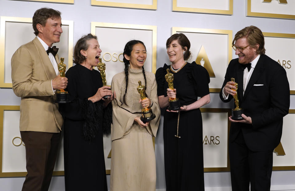 Producers Peter Spears, from left, Frances McDormand, Chloe Zhao, Mollye Asher and Dan Janvey, winners of the award for best picture for "Nomadland," pose in the press room at the Oscars on Sunday, April 25, 2021, at Union Station in Los Angeles. (AP Photo/Chris Pizzello, Pool)