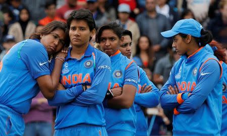 India's Jhulan Goswami (L) and team mates looks dejected at the end of the match Action Images via Reuters/Andrew Couldridge