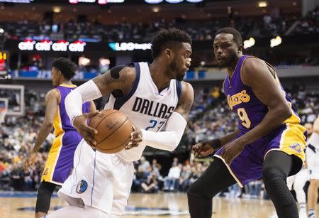 Jan 22, 2017; Dallas, TX, USA; Dallas Mavericks guard Wesley Matthews (23) moves to the basket past Los Angeles Lakers forward Luol Deng (9) during the first quarter at the American Airlines Center. Mandatory Credit: Jerome Miron-USA TODAY Sports