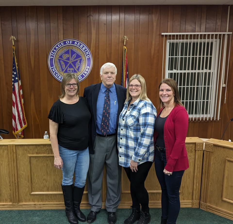 Sebring Mayor James J. Harp poses with his daughters, from left, Andrea Mashema, Julie Moats and Tracy Springer after being awarded a resolution honoring his years of service on Friday, Dec. 22, 2023.