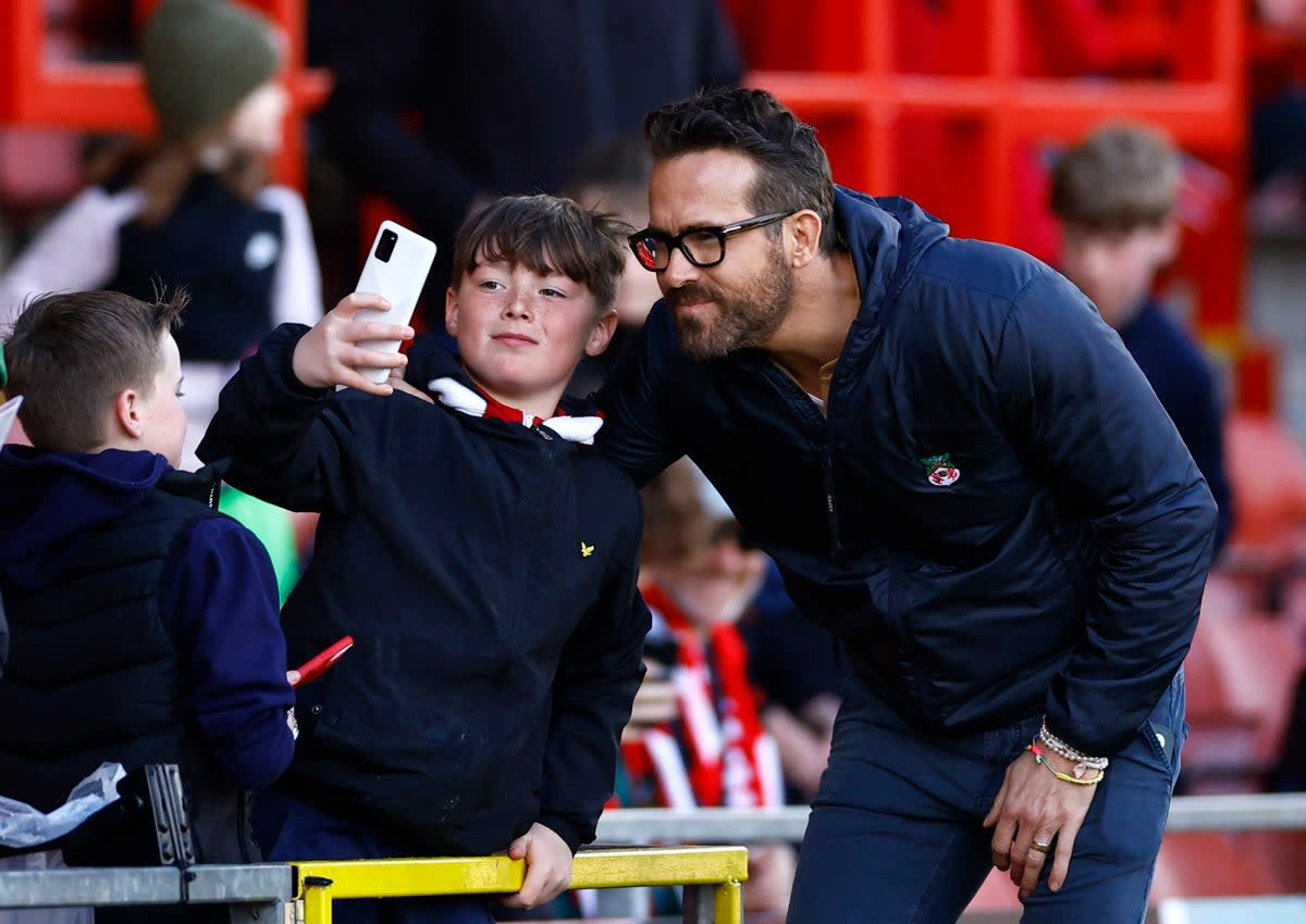 Ryan Reynolds takes a selfie with a fan before a Wrexham game  (Action Images via Reuters)