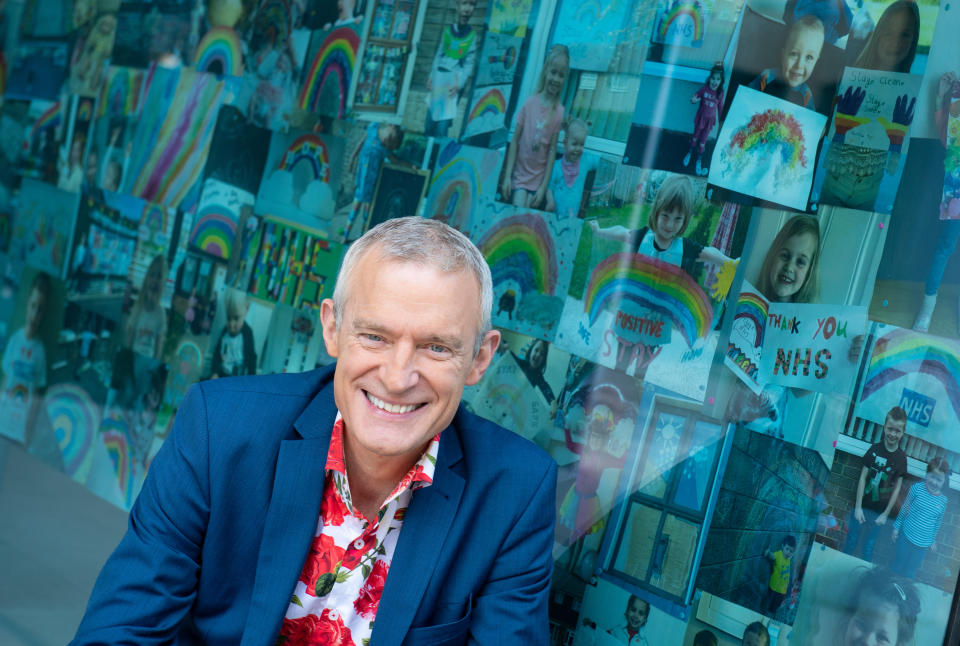 Jeremy Vine with rainbow pictures sent in by viewers of his Channel 5 show, on display in the windows of the ITN building, in central London, in tribute to the key workers battling the coronavirus outbreak. (Photo by Dominic Lipinski/PA Images via Getty Images)