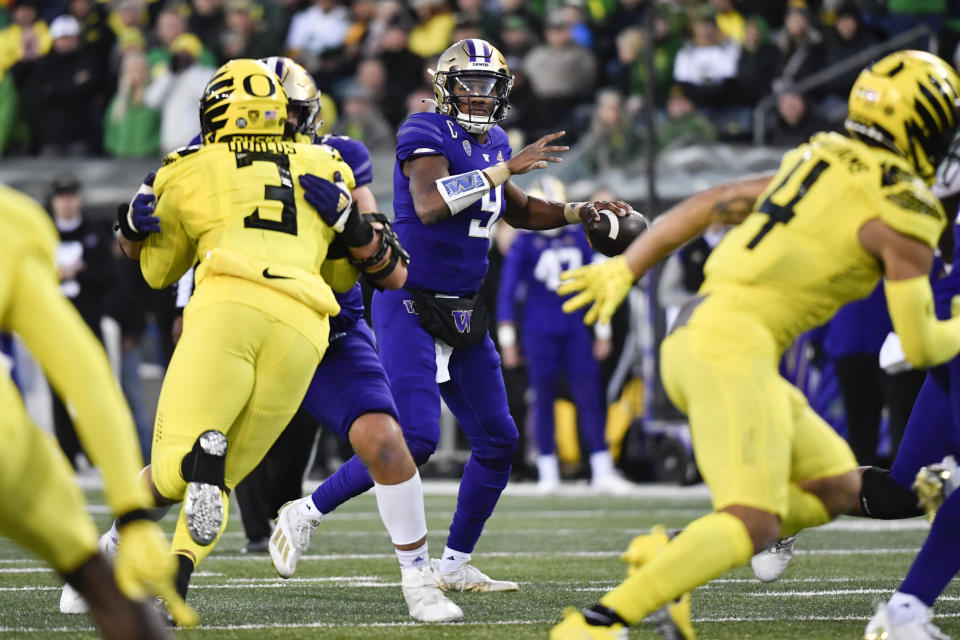 Washington quarterback Michael Penix Jr. (9) looks to pass against Oregon during the first half of an NCAA college football game Saturday, Nov. 12, 2022, in Eugene, Ore. (AP Photo/Andy Nelson)