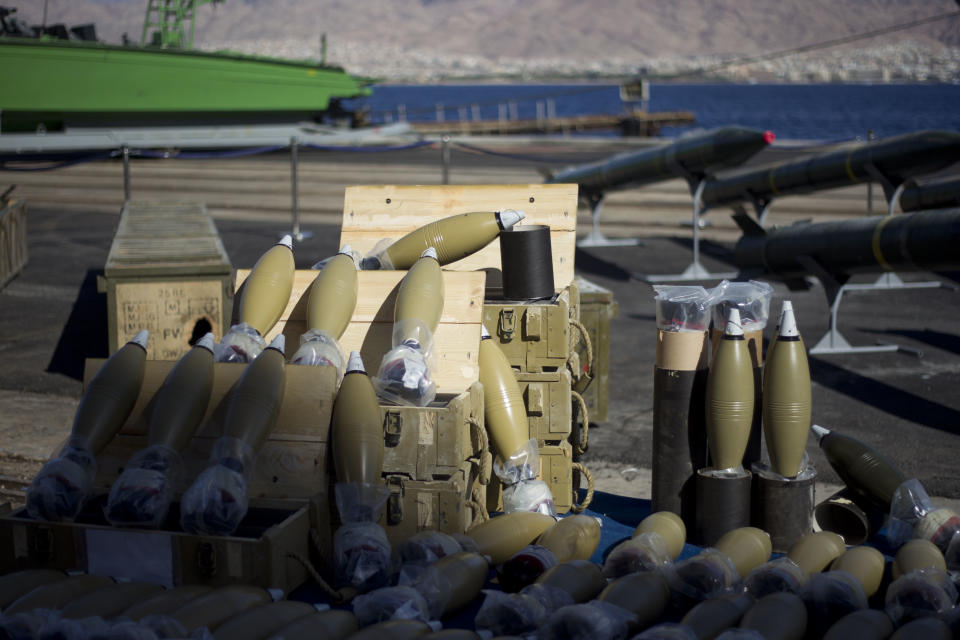 Dozens of mortar shells and rockets are on display after being seized from the Panama-flagged KLOS C civilian cargo ship that Israel intercepted last Wednesday off the coast of Sudan, at a military port in the Red Sea city of Eilat, southern Israel, Monday, March 10, 2014. Israel has alleged the shipment was orchestrated by Iran and was intended for Islamic militants in Gaza, a claim denied by Iran and the rockets' purported recipients. Questions remain, including how the rockets would have been smuggled into Gaza, largely cut off from the world by a border blockade enforced by Israel and Egypt. (AP Photo/Ariel Schalit)