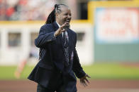 Former Cleveland baseball player Manny Ramirez laughs after throwing out a ceremonial first pitch before a game between the Detroit Tigers and the Cleveland Guardians after being inducted into the Guardians Hall of Fame, Saturday, Aug. 19, 2023, in Cleveland. (AP Photo/Sue Ogrocki)