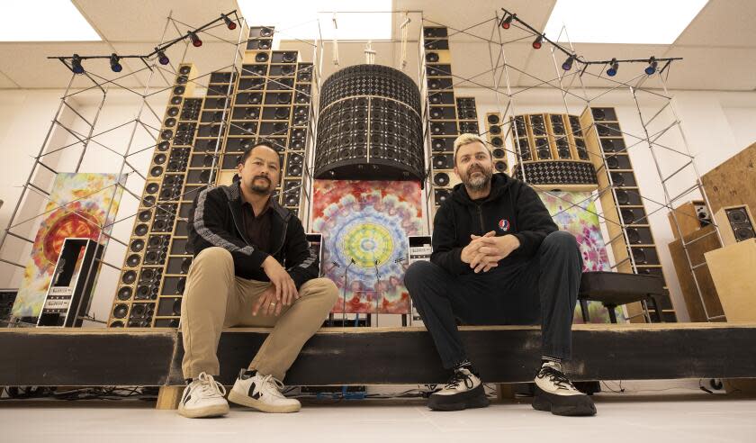 Glendale, CA - May 13, 2024: ANALOGr gallery space on Monday, May 13, 2024 in Glendale, CA. Francis Porter, left, and Thomas Scriven, co-founders of the Glendale-based rock history auction house ANALOGr with a 1/4 scale functioning model of the Grateful Dead Wall of Sound designed in 1973 specifically for the Grateful Dead's live performances. They think of themselves as the Sotheby's for popular music. They have a major Grateful Dead auction coming up that will coincide with the Dead & Company run at The Sphere in Las Vegas beginning May 15. They have an extensive collection of music memorabilia associated with the auction and a variety of music groups. (Al Seib / For The Times)