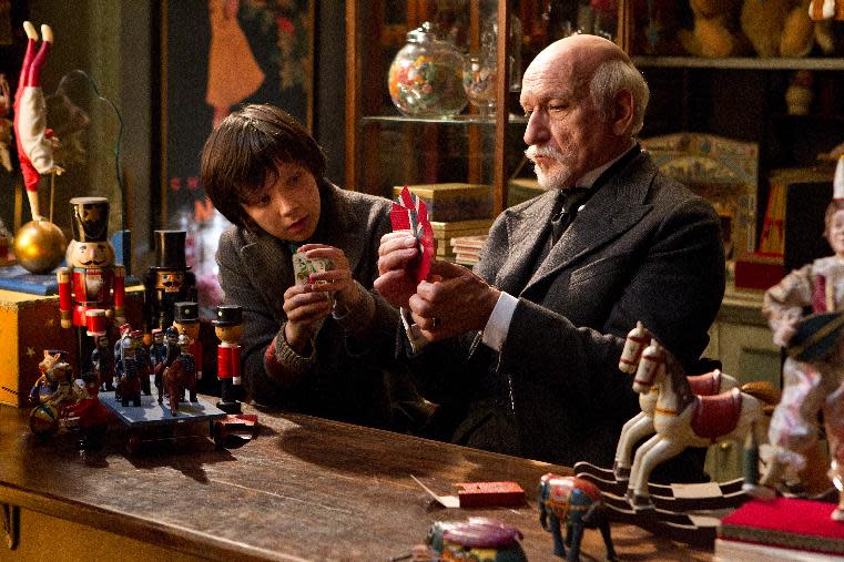 In this film image released by Paramount Pictures, Asa Butterfield portrays Hugo Cabret, left, and Ben Kingsley portrays Georges Melies in a scene from the Oscar-nominated "Hugo." The leader with 11 nominations, "Hugo" was made by Martin Scorsese, arguably Hollywood’s biggest cheerleader for the rediscovery and preservation of early films. (AP Photo/Paramount Pictures, Jaap Buitendijk)