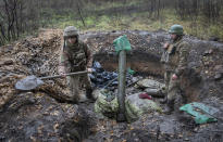 Ukrainian soldiers prepare position for the mortar in the front line near Bakhmut, the site of the heaviest battle against the Russian troops in the Donetsk region, Ukraine, Thursday, Oct. 27, 2022. (AP Photo/Efrem Lukatsky)
