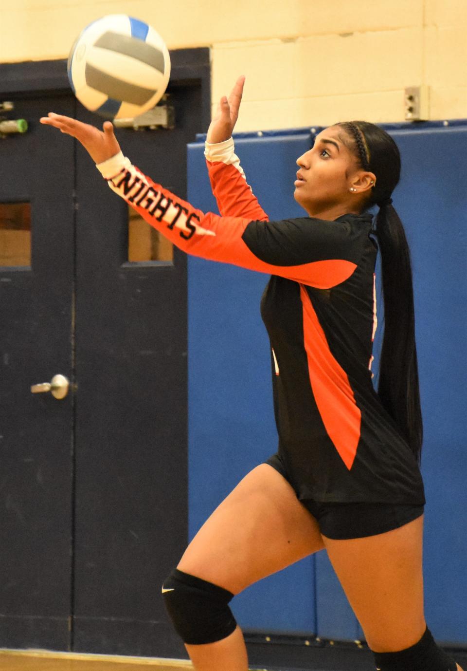 Rome Free Academy's Kassity Cruz tosses the ball up for a serve against New Hartford in November.