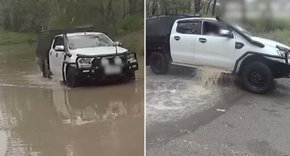 A ute is pulled from floodwaters  in Alberta, Queensland.