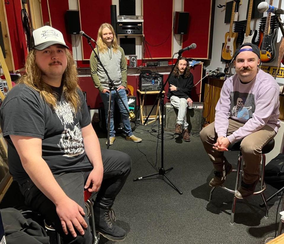 Stark County rock band Beach City Postal Service is shown in their rehearsal space in Sugar Creek Township. The band will be performing on March 16 at a Neil Young tribute concert at The Auricle in downtown Canton. From left are Russell Jones, Jake Buckridge, Dustin Mayle and T.J. Gang.
