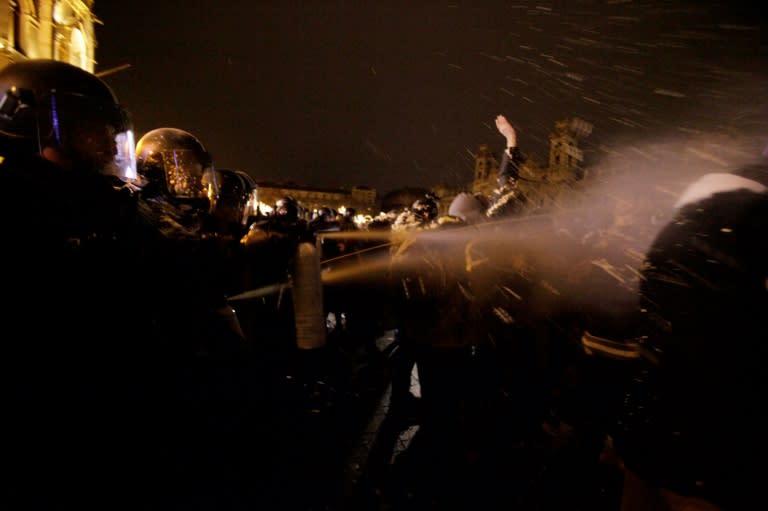 Riot police sprayed tear gas at demonstrators outside parliament in Budapest during this protest on December 14