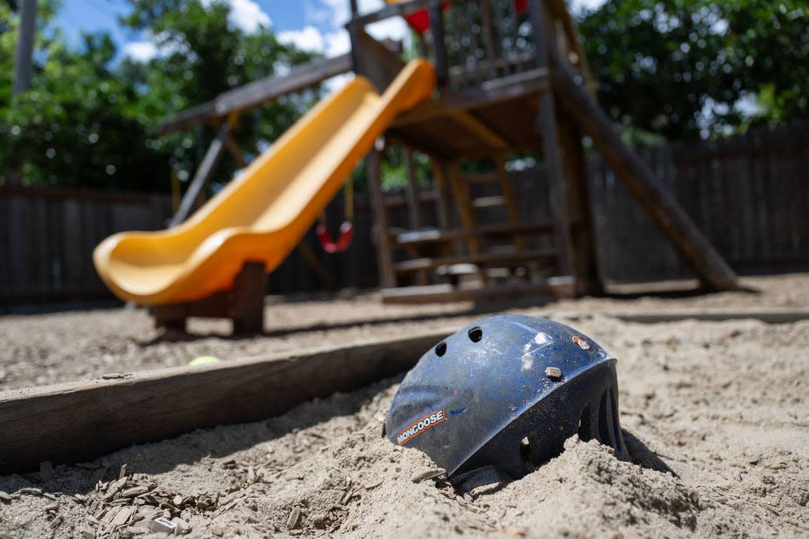 A bicycle helmet lies in a sandbox in April at Progress Ranch, a Davis short-term residential therapeutic facility for boys ages 6-13 who need full-time care. Hector Amezcua/hamezcua@sacbee.com