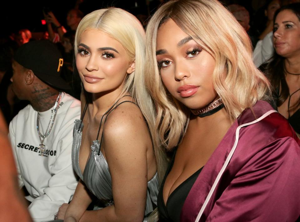 Kylie Jenner and Jordyn Woods sit close together