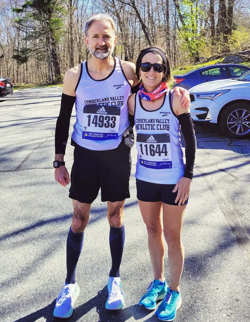 Laurie Dymond, right, of Chambersburg, Pa., poses for a photo with Rob Hovermale, of Smithsburg, in Hopkinton, Mass., before the start of the Boston Marathon on April 18, 2022.