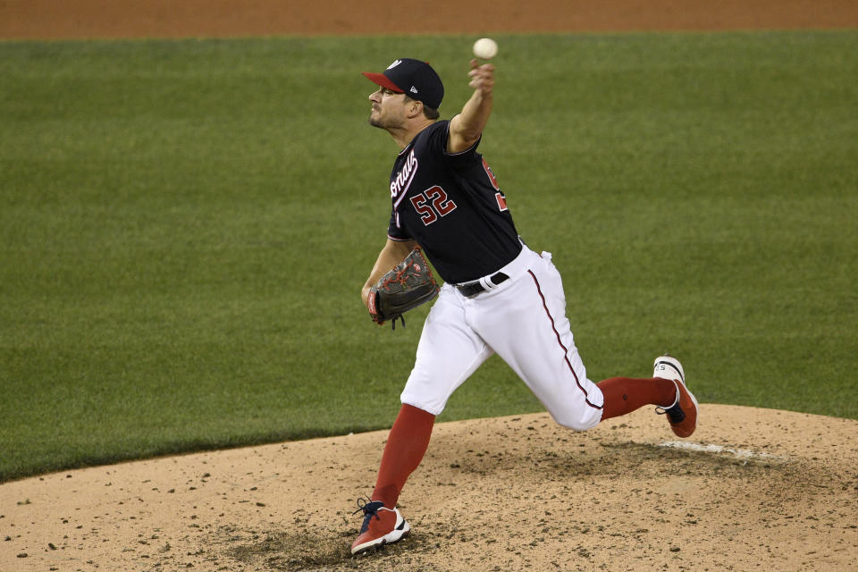 Washington Nationals relief pitcher Brad Hand delivers during the ninth inning of a baseball game against the Baltimore Orioles, Friday, May 21, 2021, in Washington. (AP Photo/Nick Wass)