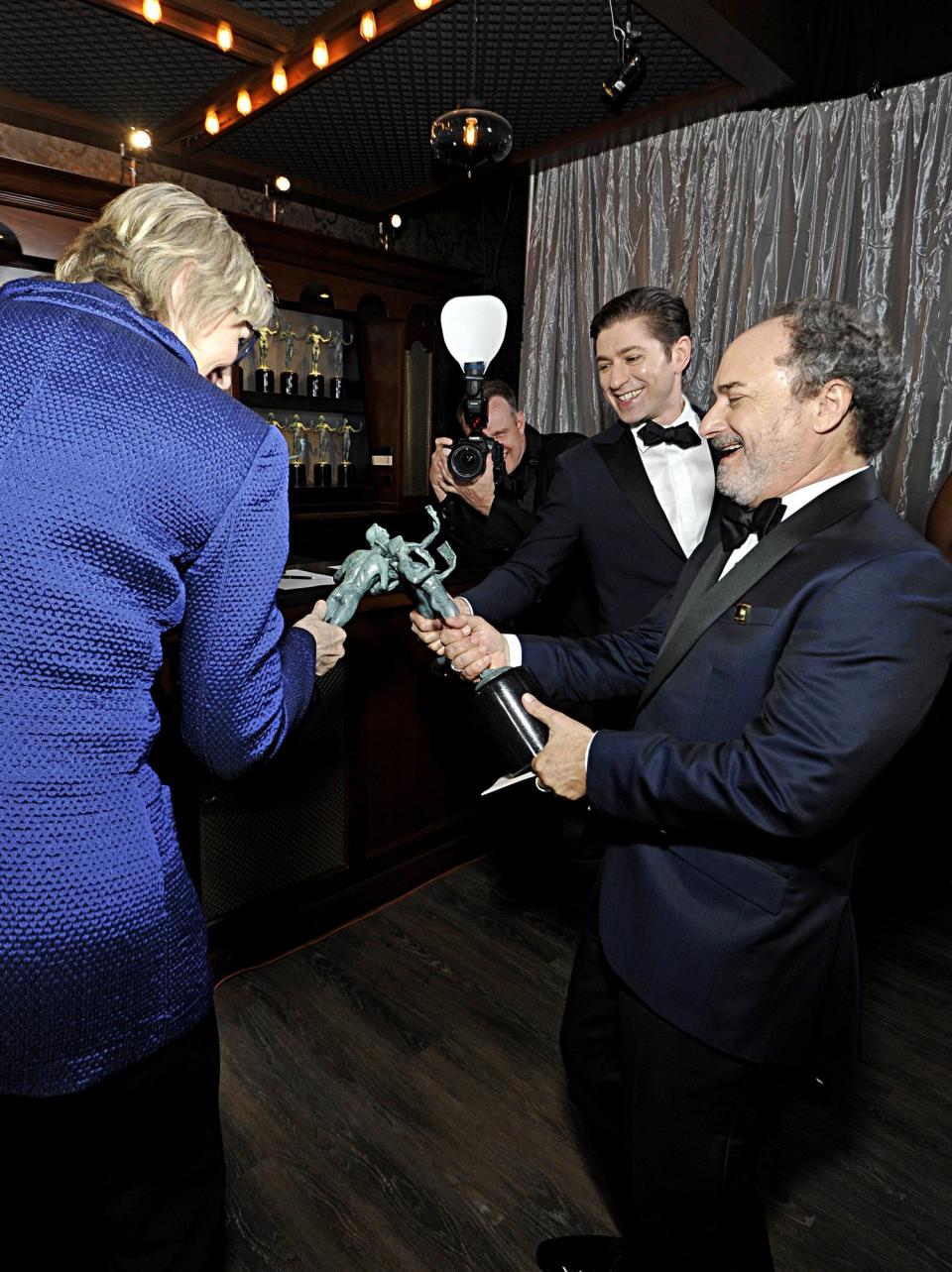 <em>Marvelous Mrs. Maisel </em>stars Jane Lynch, Michael Zegen and Kevin Pollack "cheers" with their awards for outstanding performance by an ensemble in a comedy series. 