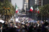 Women march to commemorate International Women's Day and protest against gender violence, in Mexico City, Monday, March 8, 2021. (AP Photo/Rebecca Blackwell)