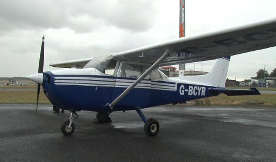 The Cessna 172 light aircraft Wednesday Oct.9, 2013 which a passenger with no flying experience landed safely at Humberside Airport, near Grimsby, England Tuesday night, after the pilot was taken ill. The man landed the plane in the dark without lights with the aid of ground instructors. The pilot was later pronounced dead. The identities of the two men aboard have not yet been released by police. (AP Photo/ Richard McCarthy, PA) UNITED KINGDOM OUT NO SALES NO ARCHIVE