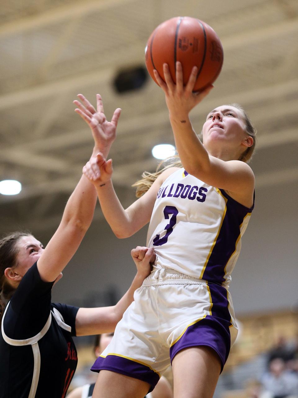Bloom-Carroll's Emily Bratton maneuvers for a shot during the Bulldogs' 64-40 victory against Jonathan Alder in a Division II district semifinal at Ohio Dominican on Wednesday, Feb. 28, 2024.