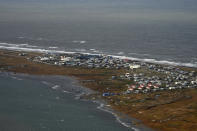 In this image provided by the U.S. Coast Guard, an aerial view taken during a search and rescue and damage assessment in Deering, Alaska, shows the damage caused by Typhoon Merbok, on Sept. 18, 2022. Authorities are making contact with some of the most remote villages in the United States to determine the need for food and water and assess damage from a massive weekend storm that flooded communities dotting Alaska's vast western coast. (Petty Officer 3rd Class Ian Gray/U.S. Coast Guard via AP)