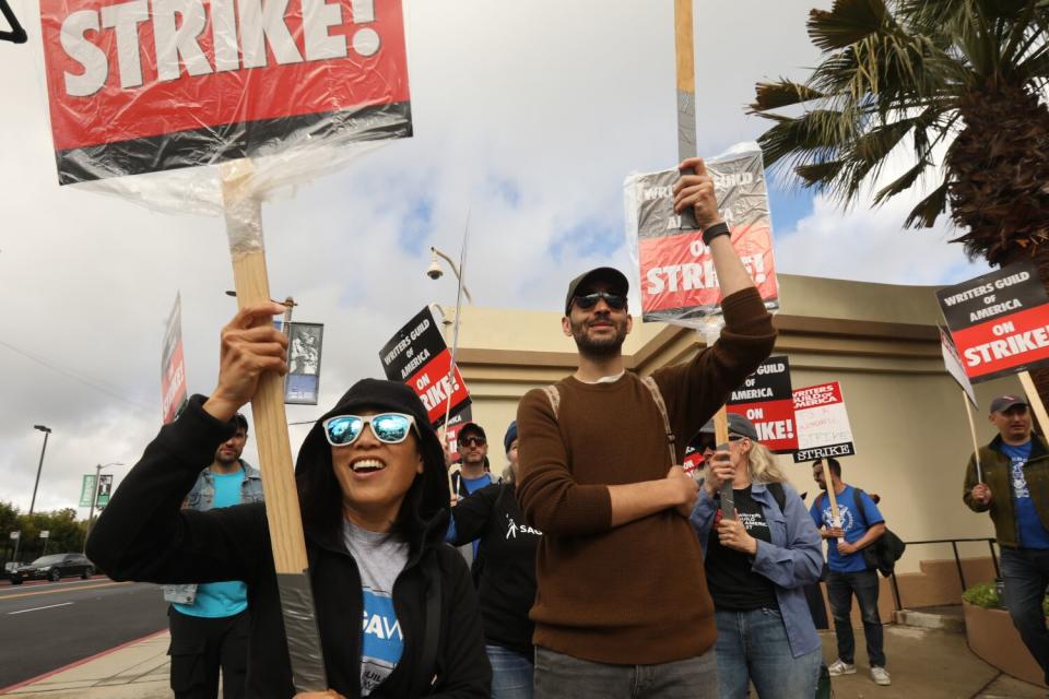 A large group of WGA members picket in front of the Paramount Studios gate in Los Angeles.