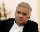 FIEL - In this Nov. 2, 2018, file photo, ousted Sri Lankan Prime Minister Ranil Wickremesinghe listens during an interview with the Associated Press at his official residence in Colombo, Sri Lanka. Sri Lanka's president has reappointed Ranil Wickremesinghe as prime minister, nearly two months after firing him and setting off weeks of political stalemate. Wickremesinghe's United National Party says on its official Twitter account that Wickremesinghe took oath before President Maithripala Sirisena on Sunday, Dec. 16, 2018. (AP Photo/Eranga Jayawardena, File)