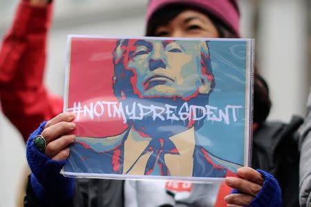 People denounce policies of U.S. President Donald Trump on Presidents Day at the Not My President's Day Rally in Los Angeles, California February 20, 2017. REUTERS/David McNew