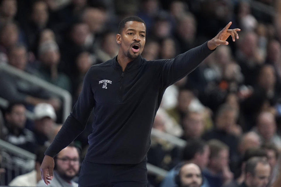 Providence coach Kim English shouts from the slildeline during the second half of the team's NCAA college basketball game against Marquette, Tuesday, Dec. 19, 2023, in Providence, R.I. (AP Photo/Steven Senne)