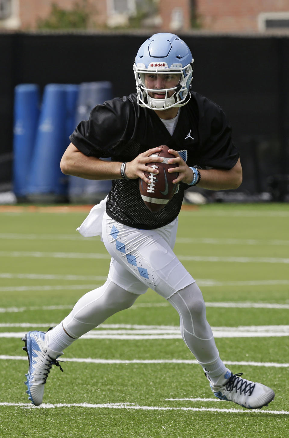 FILE - In this Aug. 2, 2019, file photo, North Carolina quarterback Sam Howell (7) is shown during an NCAA college football practice in Chapel Hill, N.C. This former top-100 prospect verbally committed to Florida State in April 2018 but selected North Carolina during the December signing period after former Seminoles offensive coordinator Walt Bell left to take over Massachusetts’ program. (AP Photo/Gerry Broome, File)